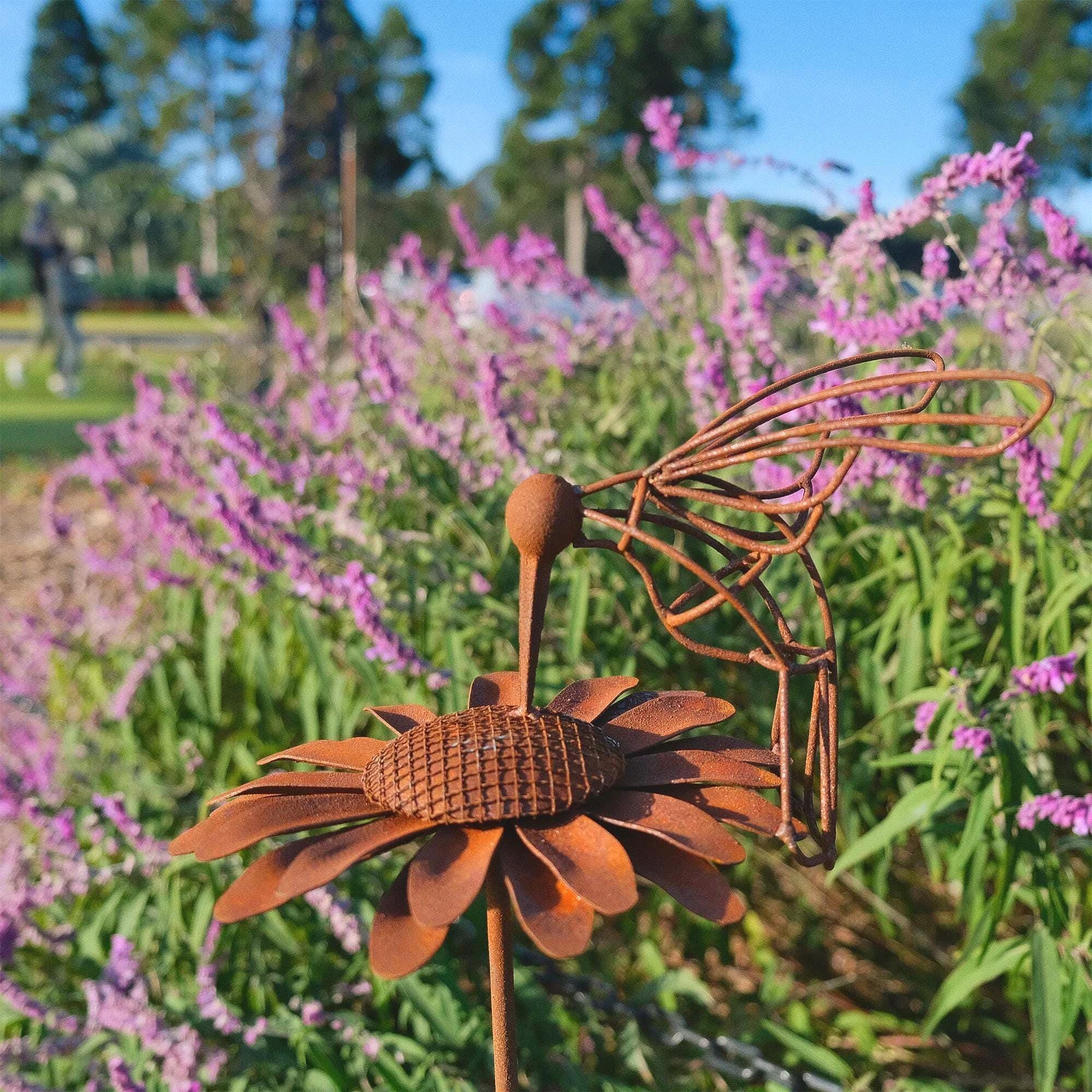 Rusty Hummingbird on Daisy Garden Stake – Handcrafted Metal Art for Outdoor Yard Decor