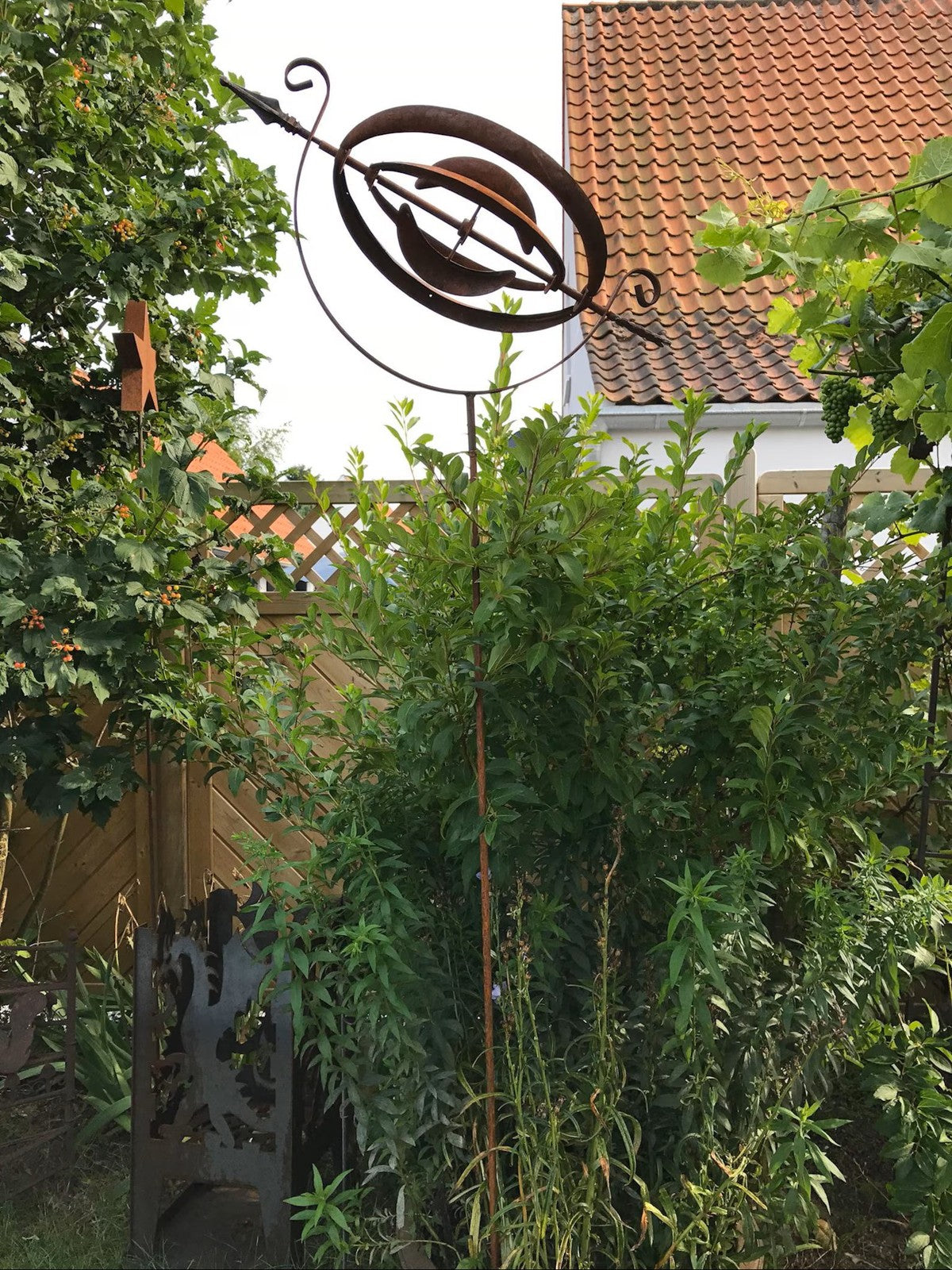 Rusty Armillary Sphere Wind Spinner — Metal Garden Ornament