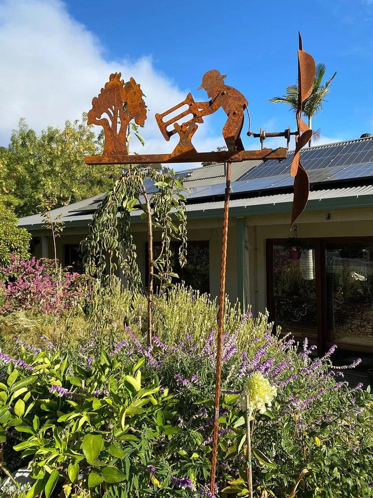 Rusty Lumberjack Wind Spinner — Kinetic Wind-Powered Metal Garden Sculpture