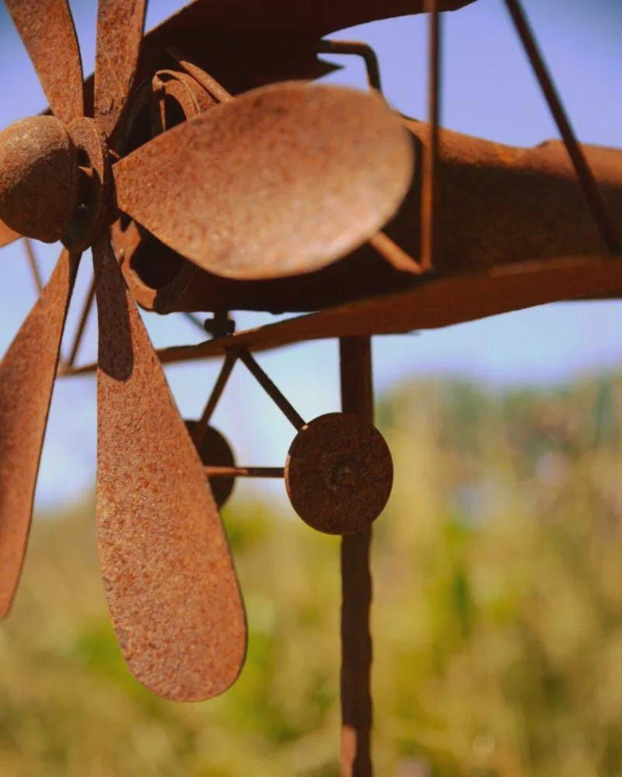 Rusty Metal Biplane Wind Spinner – Vintage Airplane Garden Art Sculpture