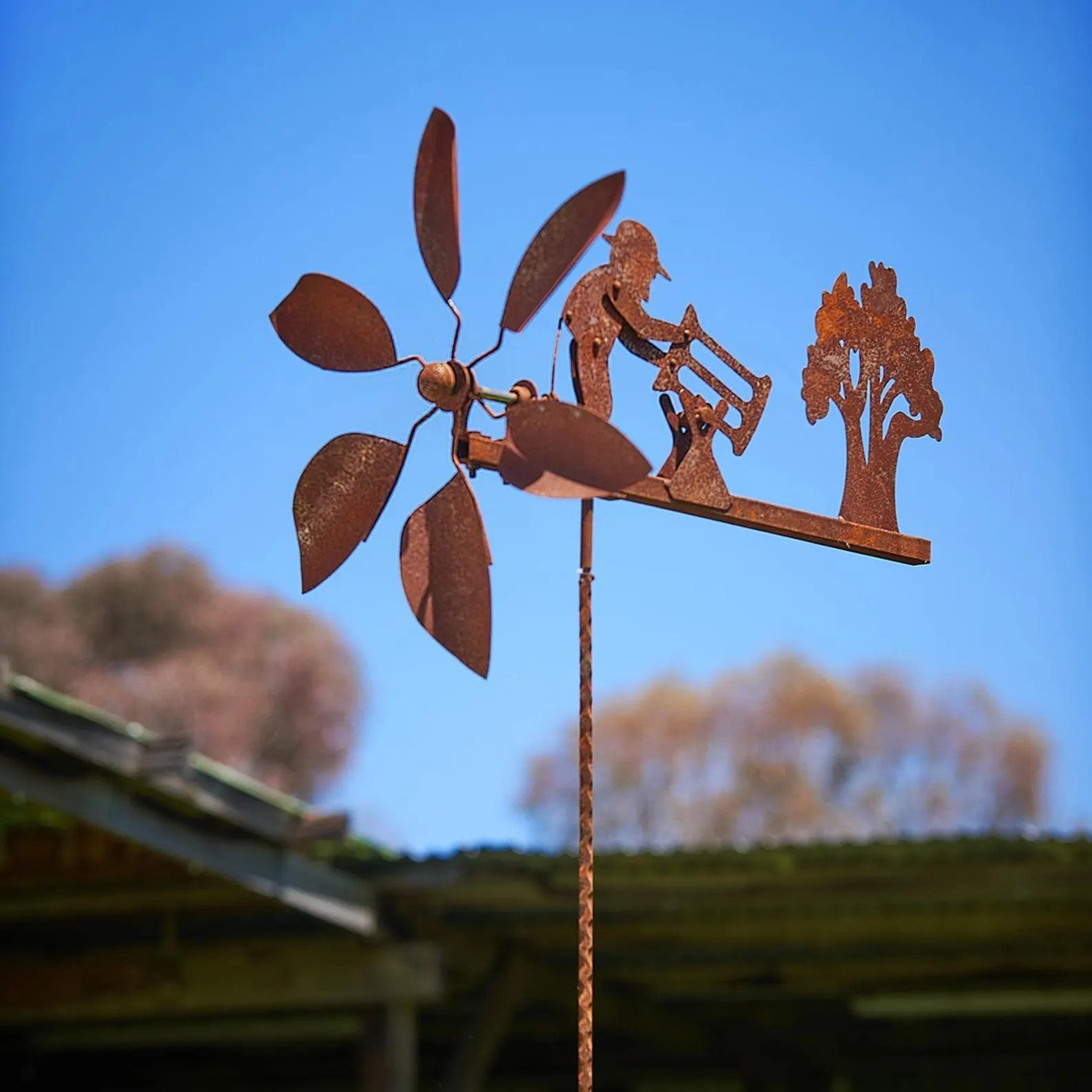 Rusty Lumberjack Wind Spinner — Kinetic Wind-Powered Metal Garden Sculpture