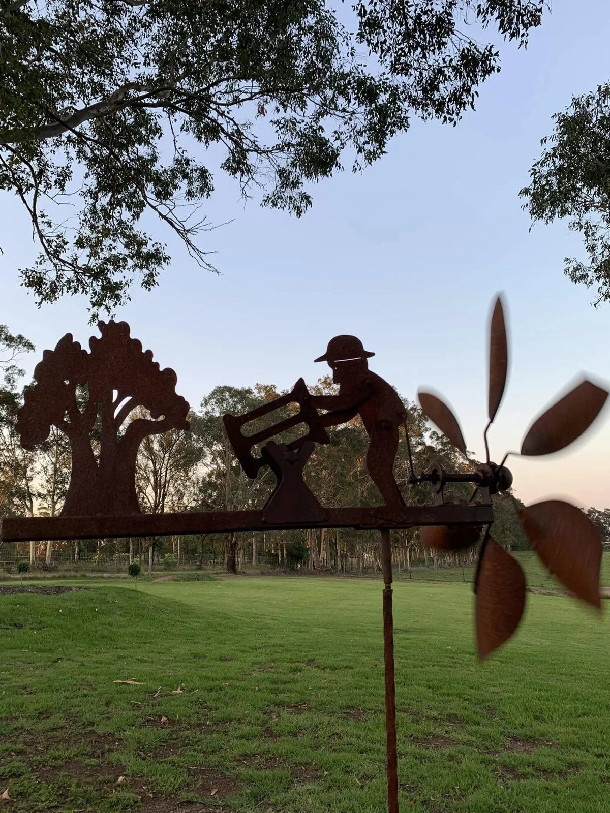 Rusty Lumberjack Wind Spinner — Kinetic Wind-Powered Metal Garden Sculpture