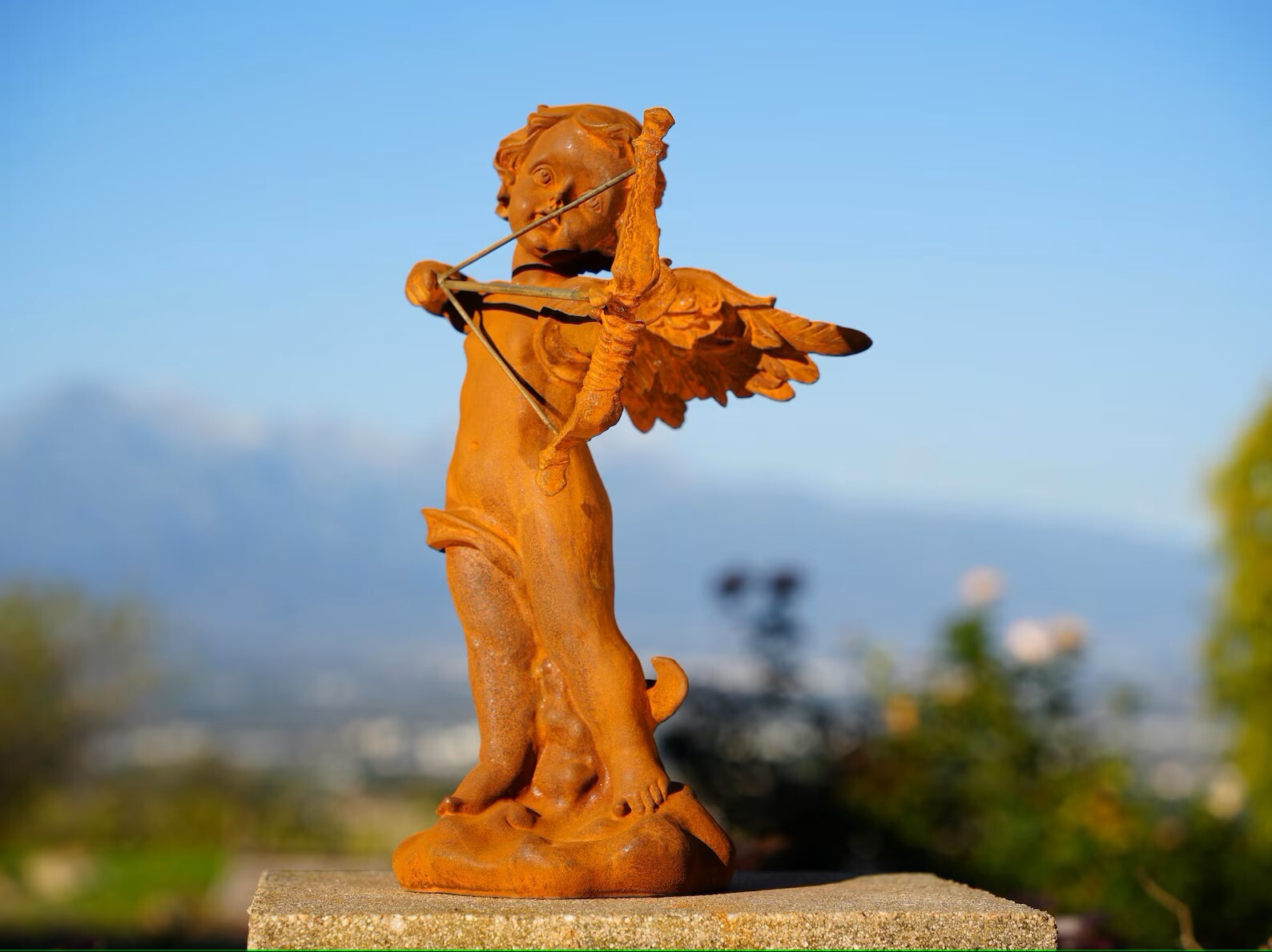 Vintage Cast Iron Cupid Statue Rustic Garden Cherub with Bow Outdoor Yard Art