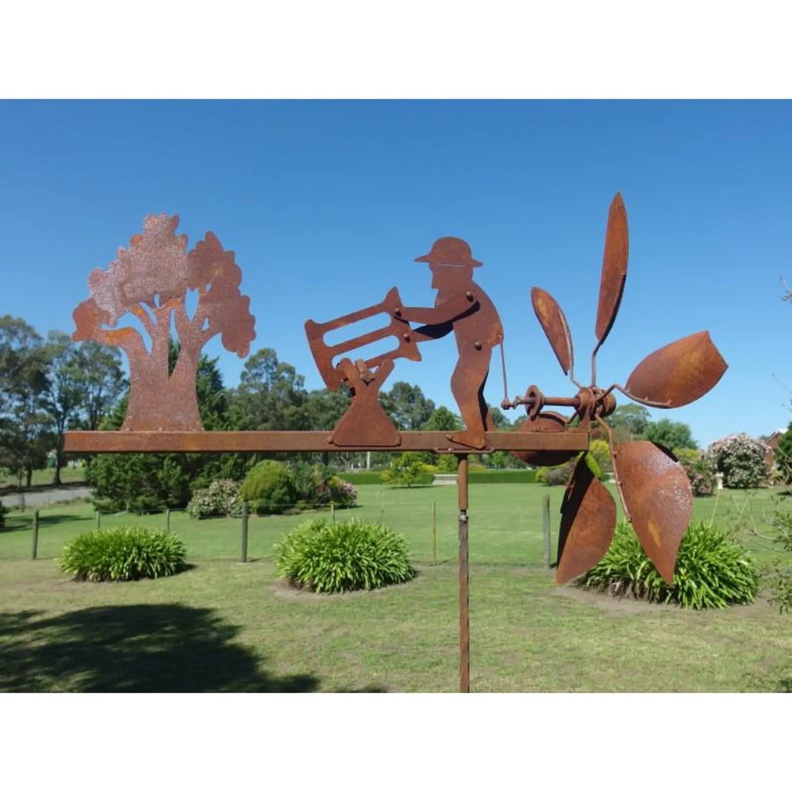 Rusty Lumberjack Wind Spinner — Kinetic Wind-Powered Metal Garden Sculpture