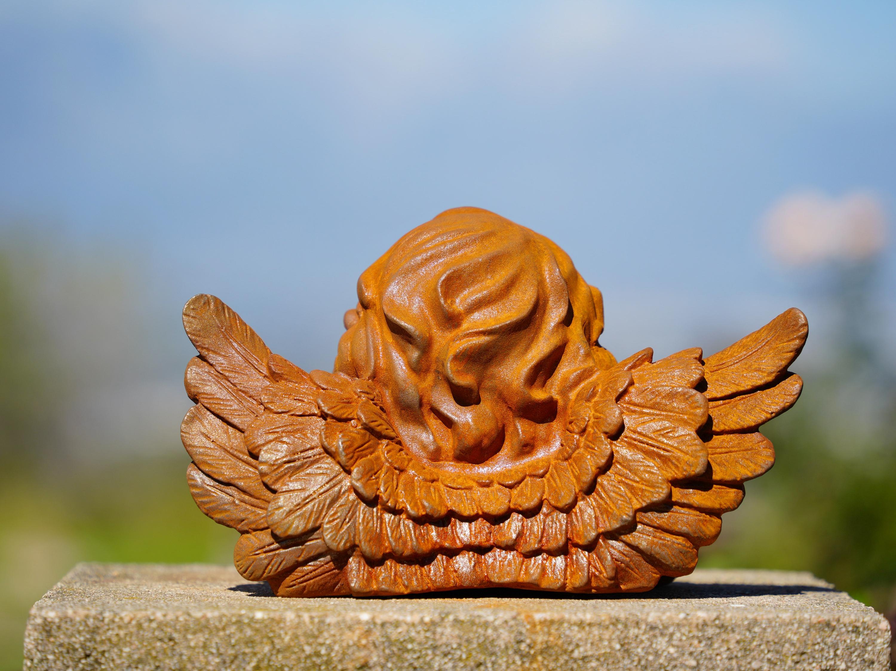 Cast Iron Dreaming Angel Sculpture: Rustic Garden Decor