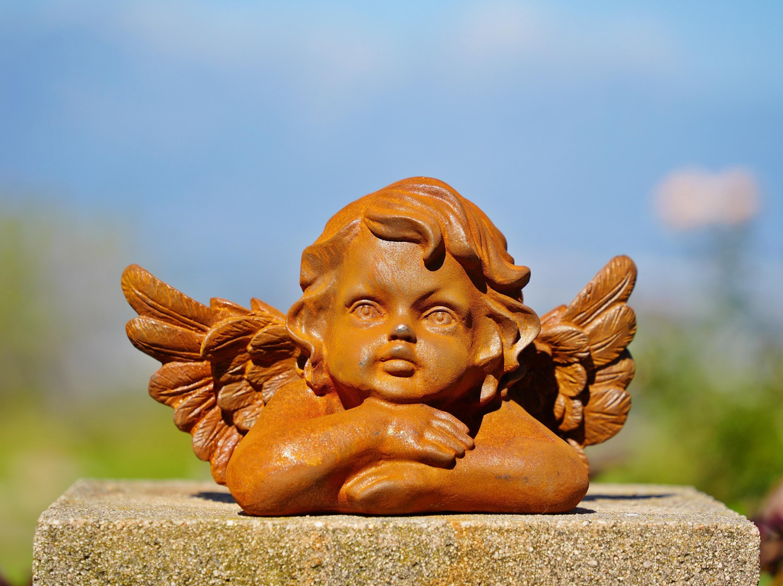 Cast Iron Dreaming Angel Sculpture: Rustic Garden Decor