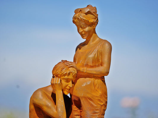 Handcrafted Cast Iron Maternity Sculpture: Expecting Couple Garden Art