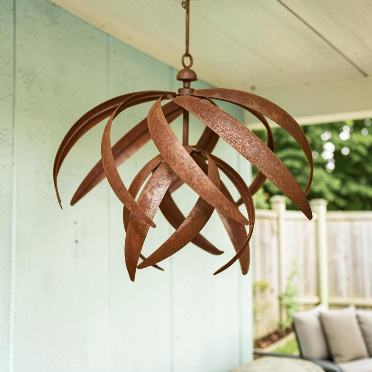 Hoisting Rusty Iron Lotus Wind Spinner - Weathered Garden Art