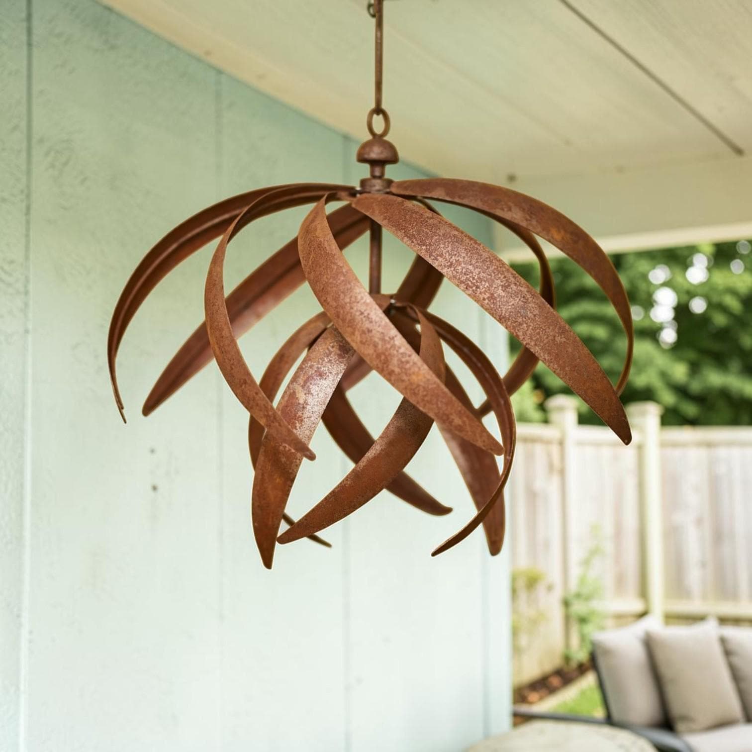 Hoisting Rusty Iron Lotus Wind Spinner - Weathered Garden Art