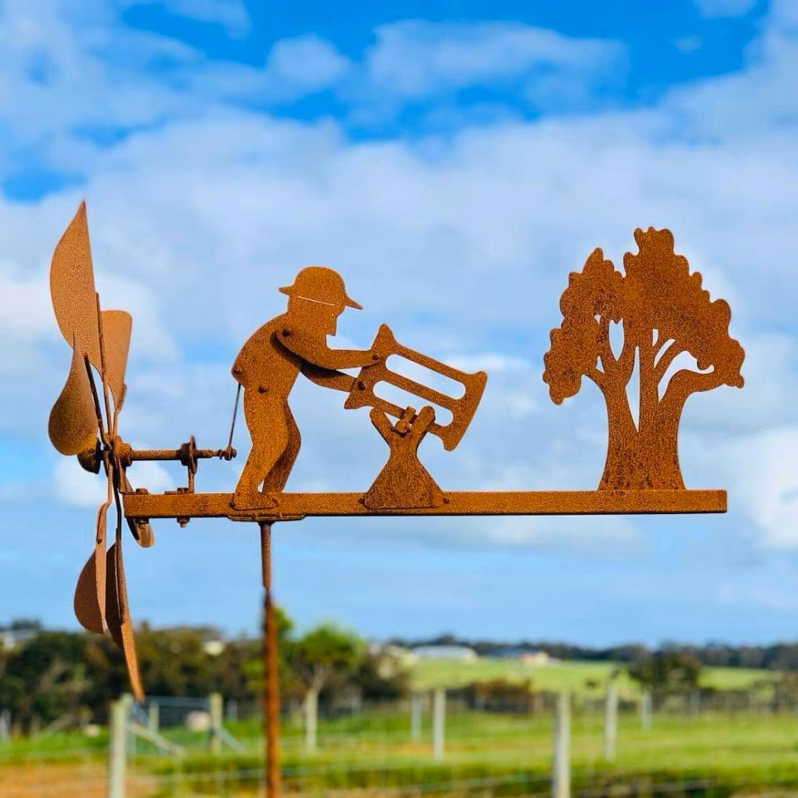 Rusty Lumberjack Wind Spinner — Kinetic Wind-Powered Metal Garden Sculpture