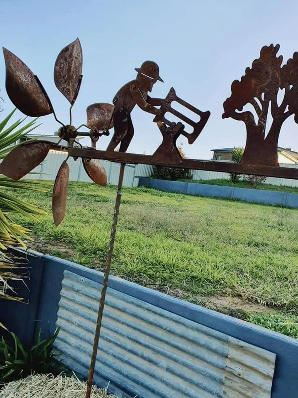 Rusty Lumberjack Wind Spinner — Kinetic Wind-Powered Metal Garden Sculpture