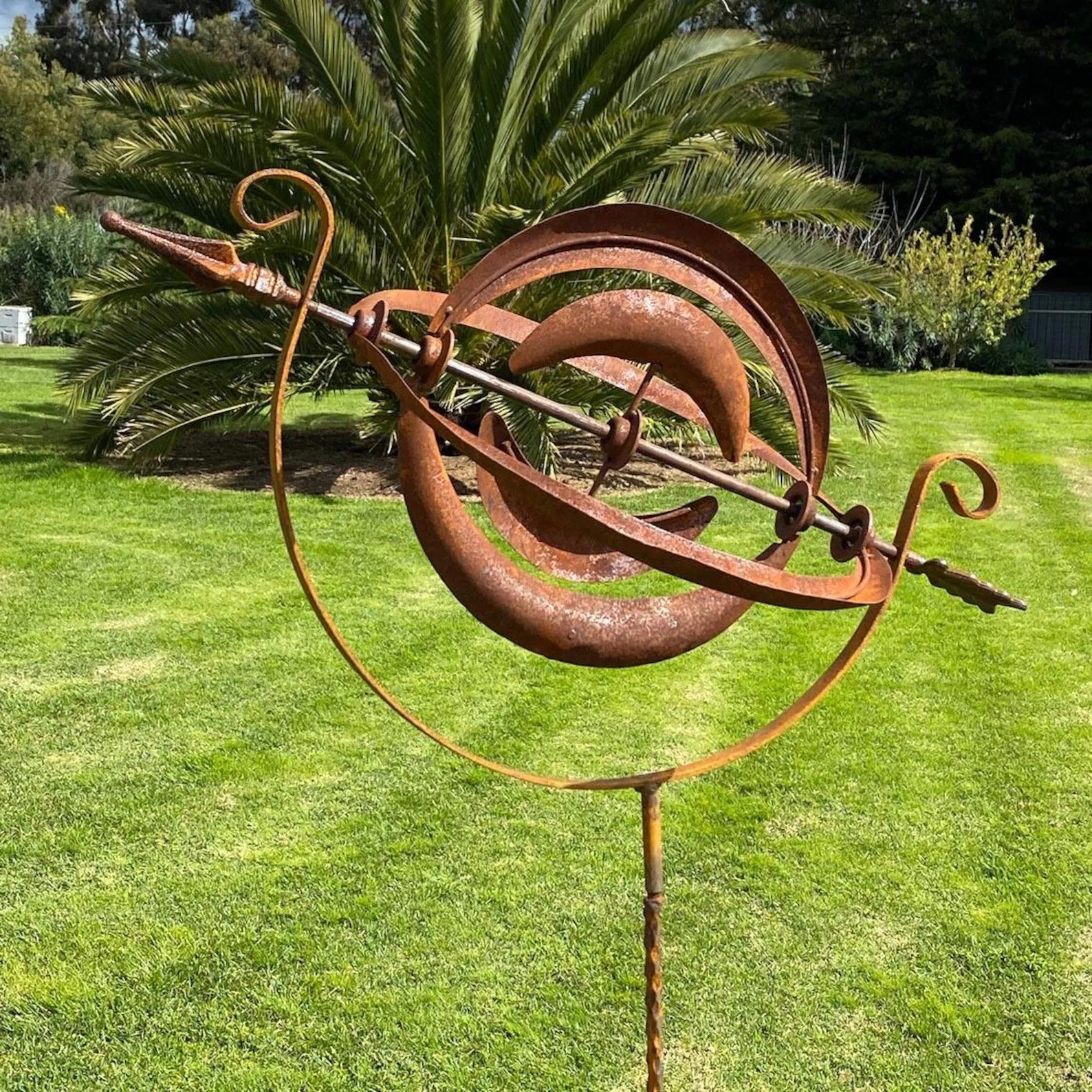 Rusty Armillary Sphere Wind Spinner — Metal Garden Ornament
